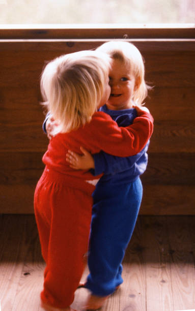 istock Blonde twin toddlers dancing indoors 1135213522