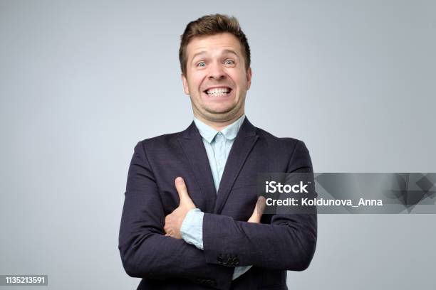 Mature Business Man Laughs From Ear To Ear Giggles On The Funny Stories Stock Photo - Download Image Now