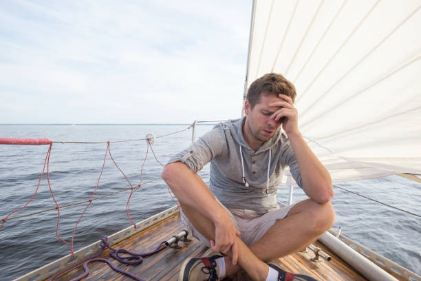young european man having a nausea seasickness. He is trying to stop vomiting. stock photo