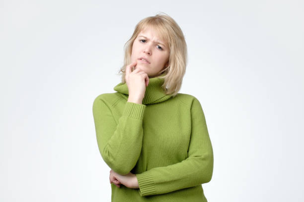 istock Woman in green sweater making a plan on her holidays. 1135215123