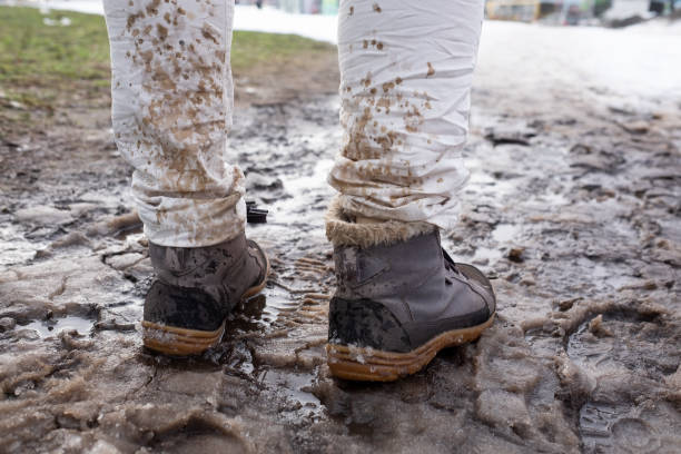 istock Splashing and melting snow drops on white jeans. 1135215331