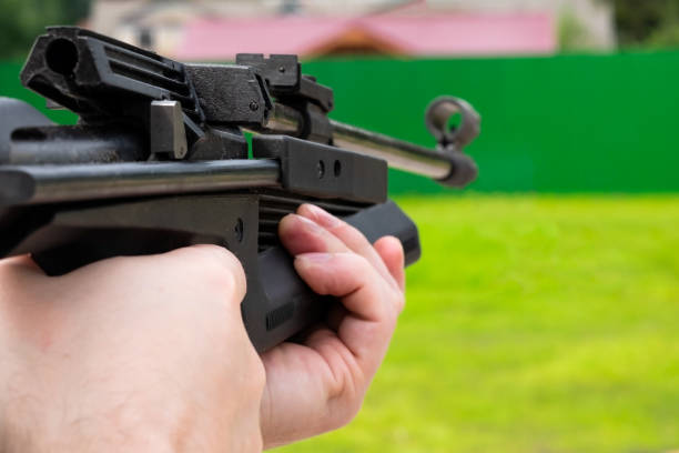 istock Man shoots at target from pneumatic gun at summer day 1135215426