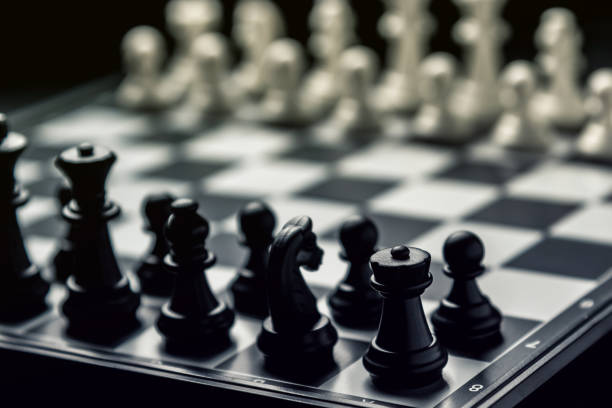 istock Chess board with black and white chess facing each other 1135215471