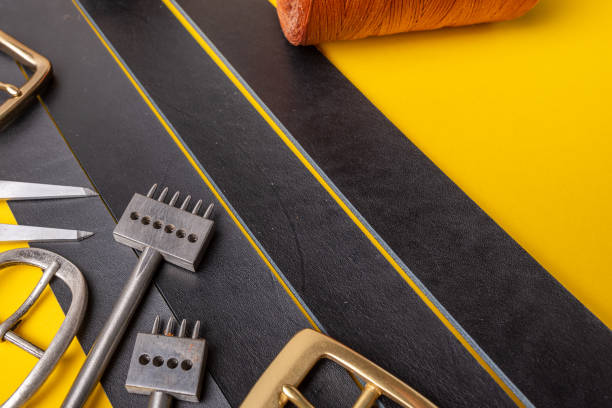 istock Sewing process of the leather belt. Tools, materials and accessories for leather workshop. Vintage sewing industrial 1135216324