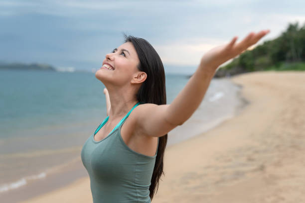 istock Peaceful woman relaxing at the beach 1135216567