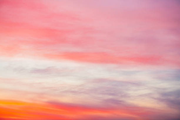 istock Sunset sky with pink orange light clouds. Colorful smooth blue sky gradient. Natural background of sunrise. Amazing heaven at morning. Slightly cloudy evening atmosphere. Wonderful weather on dawn. 1135219131