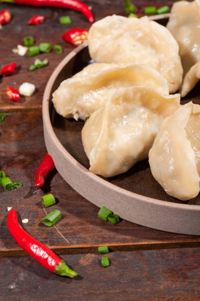 istock Steamed dumplings and seasonings on the table 1135221089