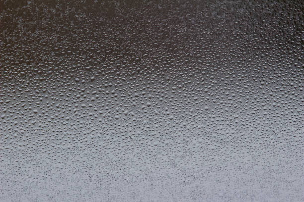 istock Macro abstract of droplets from melting ice on a window 1135224296