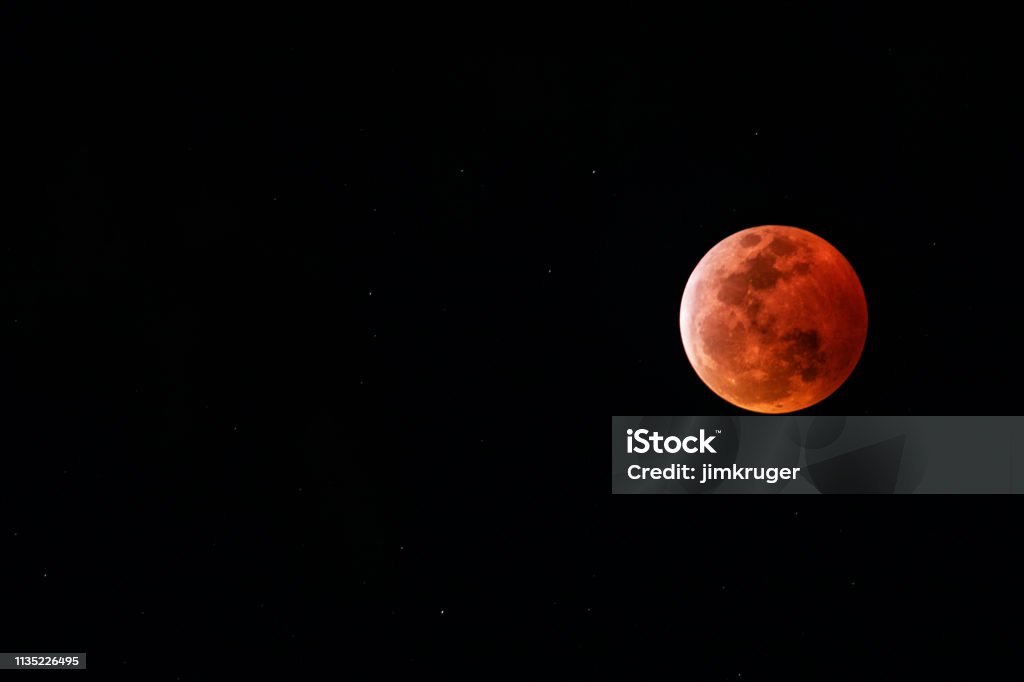 Super blood moon 2019 Kapaa, HI, - January 20, 2019: Super blood moon from the island of Kaua"u2019i Hawaii. The super blood moon is a nickname for when there is a total lunar eclipse which coincides with the moon at perigee. Moon Stock Photo