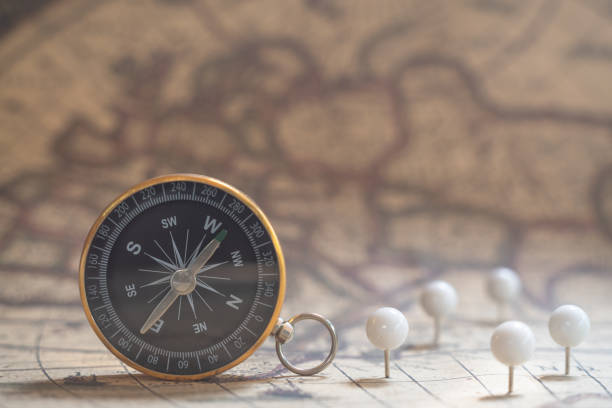 istock Compass old vintage brown map background, journey planning concept, copy space 1135232055
