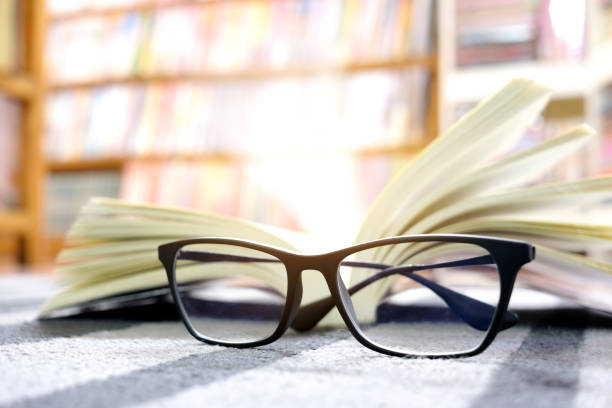 istock Glasses and books Placed at the library 1135235499