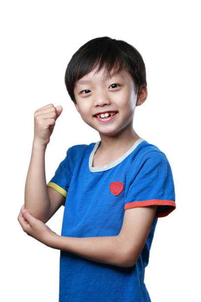 istock Portrait of smiling boy  white background 1135235539