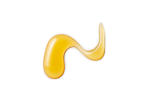 istock Macro one honey drops isolated on white background, File contains a clipping path. 1135236768