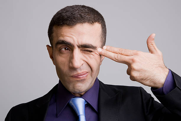 istock Businessman shooting self in head 113523919