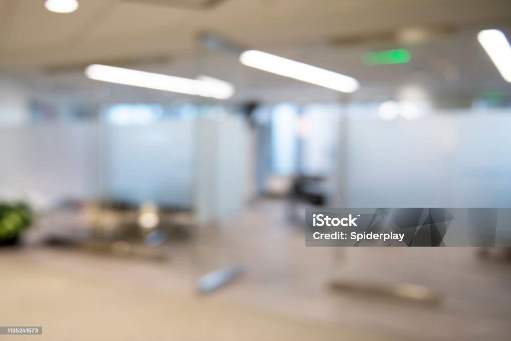 Modern Conference Room Background Modern conference room with walls of glass. There is a section of glass that is frosted. It is bright and airy. The entrance to the conference room is open. Office Stock Photo