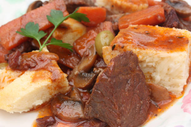 istock Beef stew cooked with red wine served with polenta 1135244837