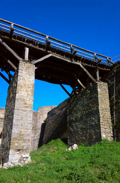 istock Bridge with brick supports and wooden boards for the transition. 1135248126