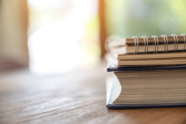 istock Books and notebooks on wooden table 1135248205