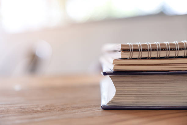 istock Books and notebooks on wooden table 1135248824