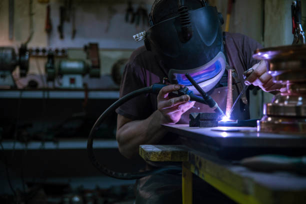 istock The welder working on the brass details with the electrical welding 1135251542