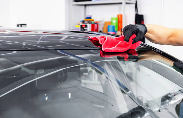 istock A man cleaning car with microfiber cloth. Car detailing or valeting concept. Selective focus. Car detailing. Cleaning with sponge. Worker cleaning. Car wash concept solution to clean 1135252791