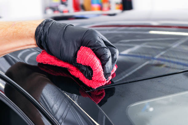 istock A man cleaning car with microfiber cloth. Car detailing or valeting concept. Selective focus. Car detailing. Cleaning with sponge. Worker cleaning. Car wash concept solution to clean 1135252955