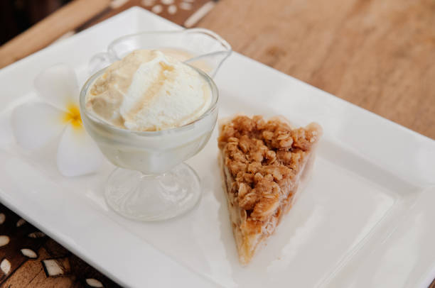 istock Apple crumble pie with rich ice cream in glass cup 1135253549