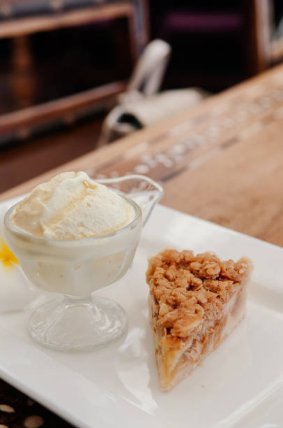 istock Apple crumble pie with rich ice cream in glass cup 1135253561