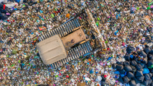 istock Garbage pile  in trash dump or landfill, Aerial view garbage trucks unload garbage to a landfill,  global warming. 1135254593