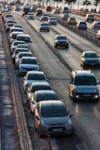 istock Blurry image of rush hour traffic on busy highway at sunset 1135254597
