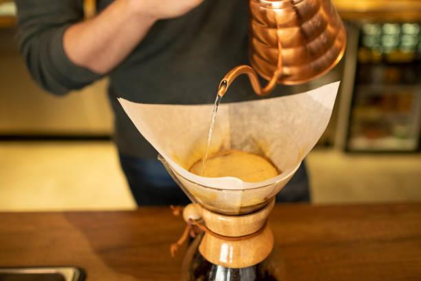 istock Male Barista Brewing Coffee 1135254638