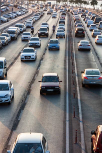 istock Blurry image of rush hour traffic on busy highway at sunset 1135254779