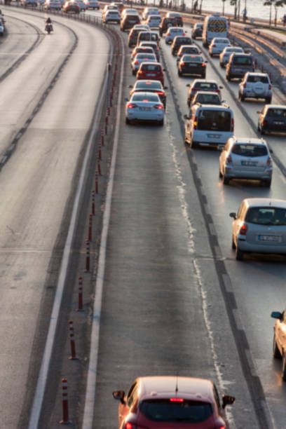 istock Blurry image of rush hour traffic on busy highway at sunset 1135254782