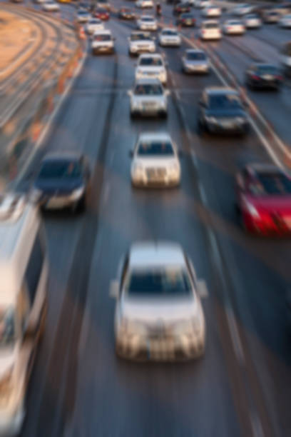 istock Blurry image of rush hour traffic on busy highway at sunset 1135254802