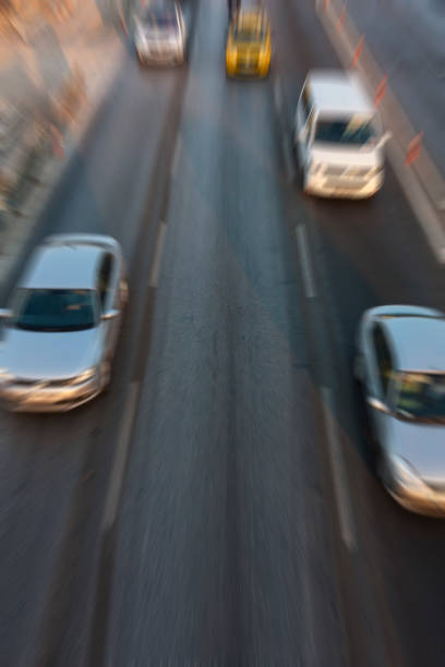 istock Blurry image of rush hour traffic on busy highway at sunset 1135255938