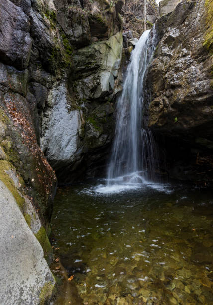 istock Kostenski Falls - a waterfall in the Rila Mountains, located along the Old River about three kilometres south of the village Kostenets. The water drops 12 metres. Rocky canyon. 1135255996