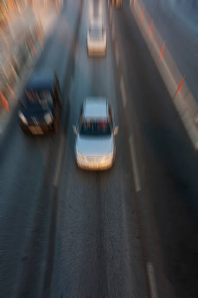 istock Blurry image of rush hour traffic on busy highway at sunset 1135256024
