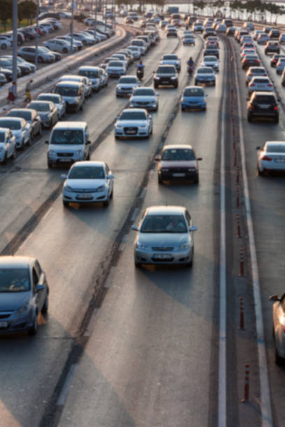 istock Blurry image of rush hour traffic on busy highway at sunset 1135256087