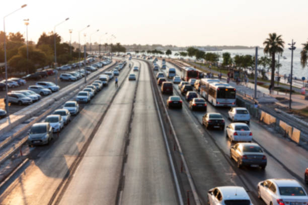 istock Blurry image of rush hour traffic on busy highway at sunset 1135256124