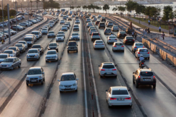 istock Blurry image of rush hour traffic on busy highway at sunset 1135256792
