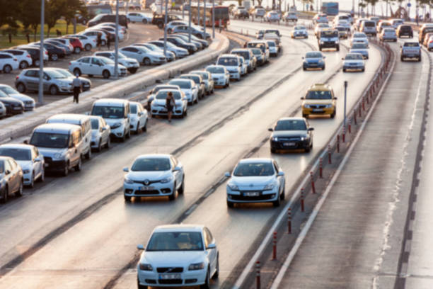 istock Blurry image of rush hour traffic on busy highway at sunset 1135258006