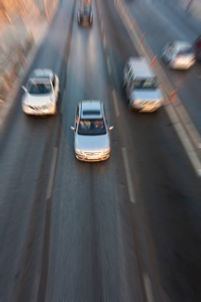 istock Blurry image of rush hour traffic on busy highway at sunset 1135258087