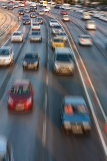 istock Blurry image of rush hour traffic on busy highway at sunset 1135258107