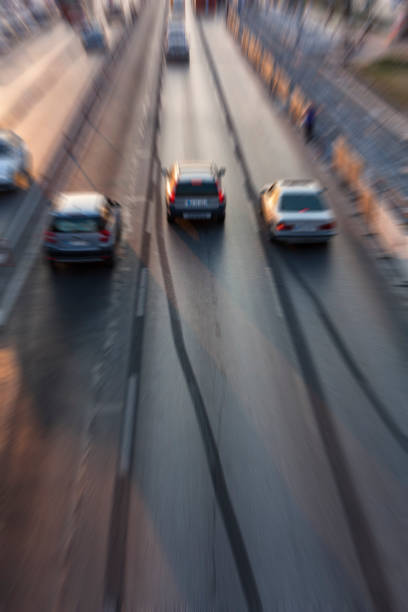 istock Blurry image of rush hour traffic on busy highway at sunset 1135258186