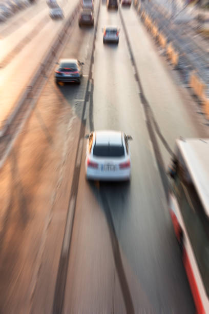 istock Blurry image of rush hour traffic on busy highway at sunset 1135258270