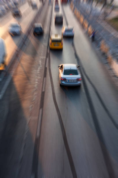 istock Blurry image of rush hour traffic on busy highway at sunset 1135258366