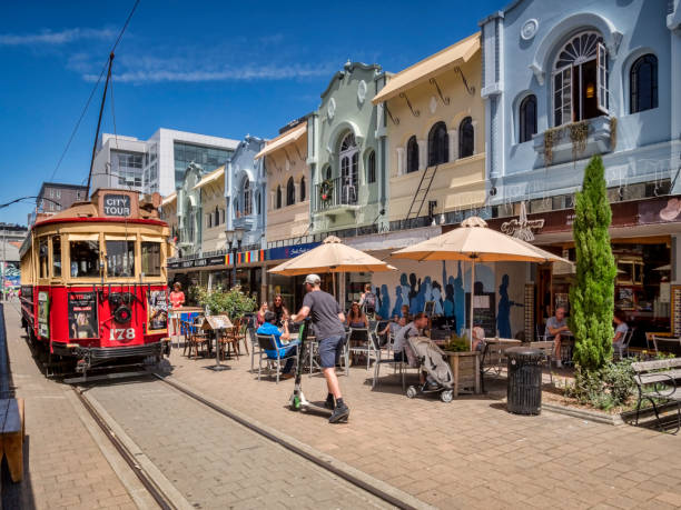 New Regent Street with Tram, Christchurch New Zealand 3 January 2019: Christchurch, New Zealand - New Regent Street in the centre of Christchurch, with outdoor cafes and speciality shops, and the tram route running through it. lime scooter stock pictures, royalty-free photos & images