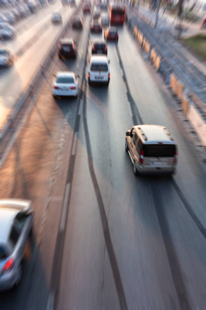 istock Blurry image of rush hour traffic on busy highway at sunset 1135258397