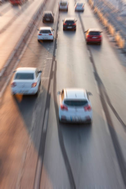 istock Blurry image of rush hour traffic on busy highway at sunset 1135258859