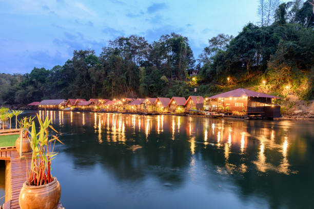 tropical wooden raft resort illumination on river kwai at dawn - balsa tree imagens e fotografias de stock